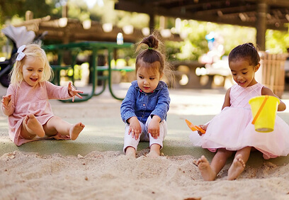 children playing in sandpit